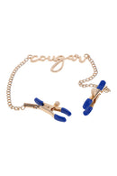 PINÇAS PARA MAMILOS DOURADAS COM A PALAVRA "COUGAR"