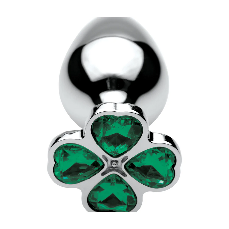 PLUG METALICO COM PEDRA VERDE EM FORMA DE TREVO